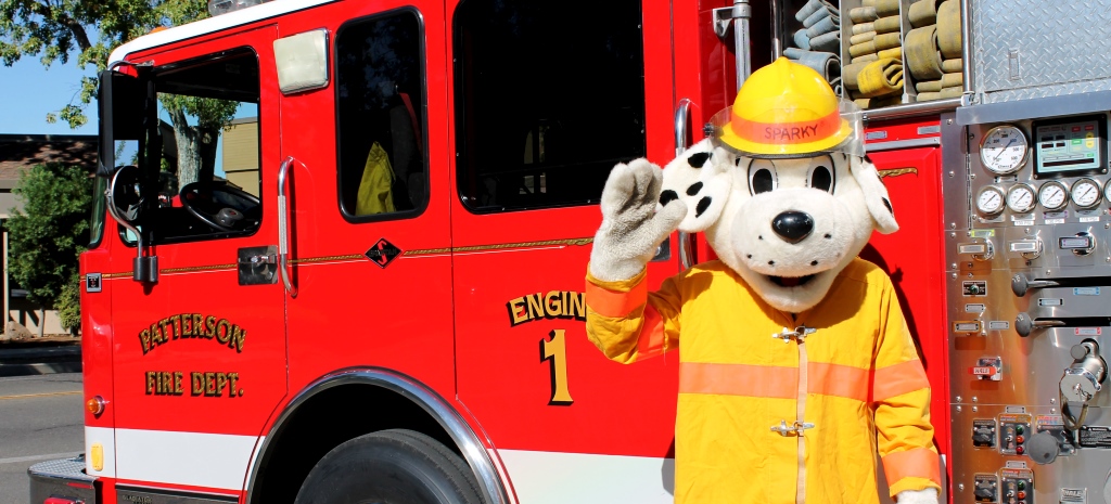 Sparky by a Fire Truck